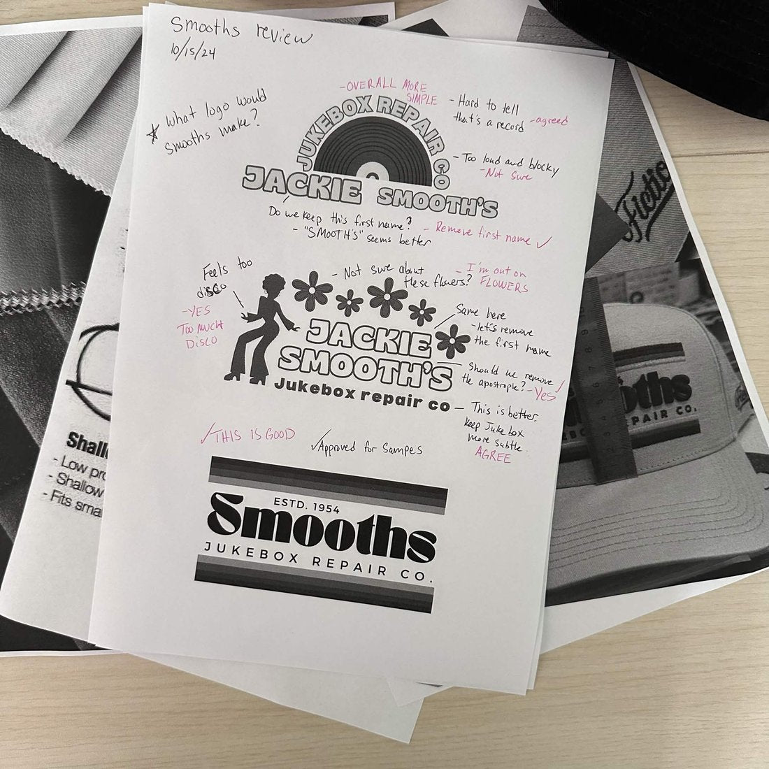 Printed Smooths logo designs marked up by hand in pen, the final lockup approved for samples